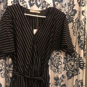 Black jumpsuit with white stripes